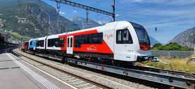 The Z 890 trainsets arrive via the standard gauge network, carried on a flat car.